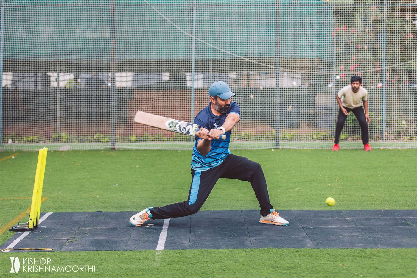 A batsman sweeping the ball at the box cricket tournament